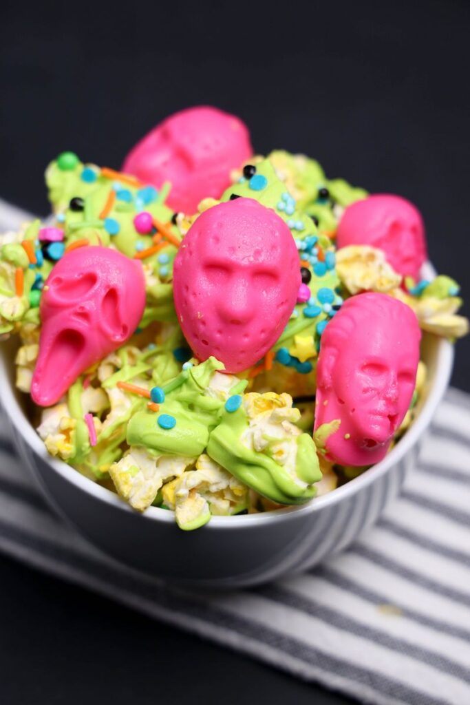 Summerween Horror Popcorn with neon pink slasher heads.